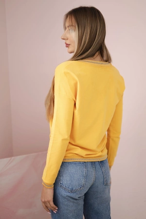 Bluza damska z napisem z cekinami musztardowa