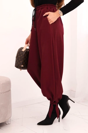Spodnie damskie z szeroką nogawką i wiązaniem u dołu bordowe