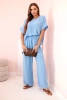 Komplet damski z wiskozy z ozdobnym kwiatem i szerokimi spodniami niebieski